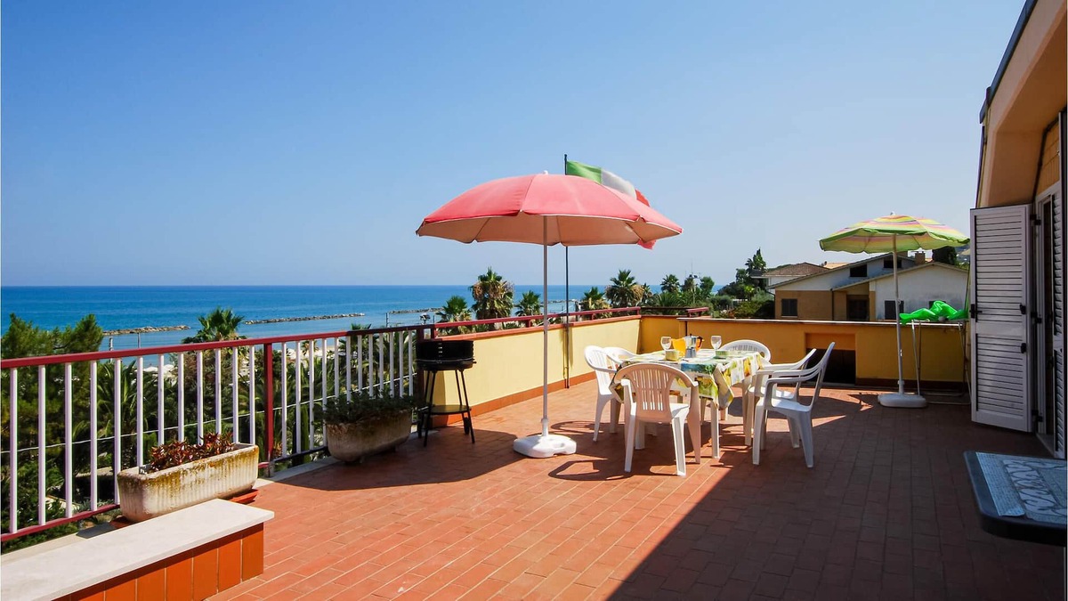 Campofilone Apartment | Relax with a cool drink on your terrace overlooking the sea.