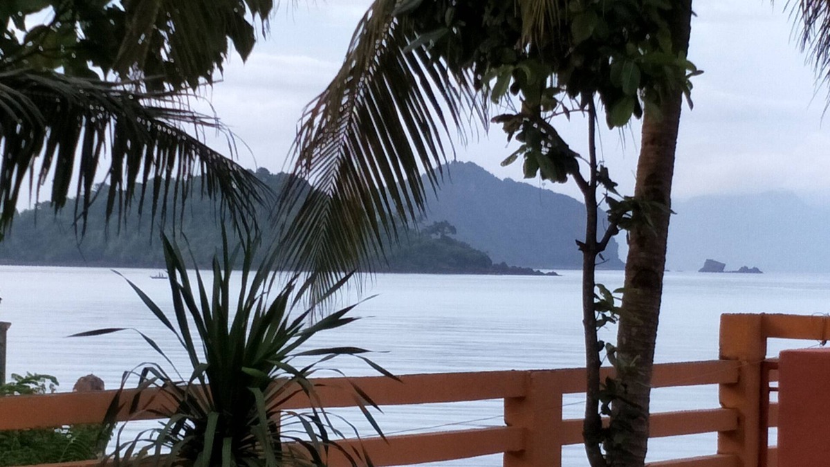 Calapan Condo | Relaxing beach side condo with mountain and island views.
