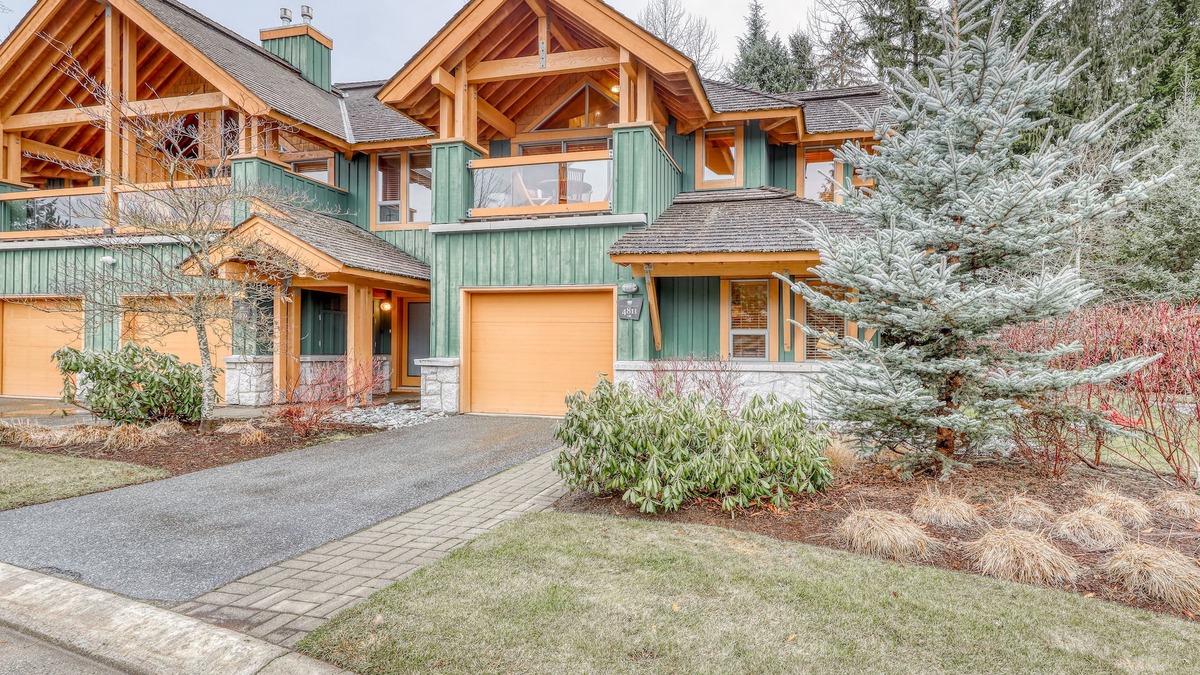 Village North House | Relaxing first-floor townhouse with a private hot tub, fireplace, & great views