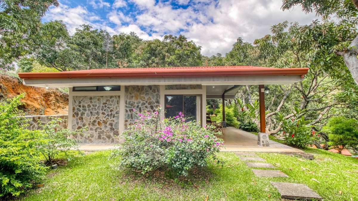 Santa Eulalia House | Relaxing, ground-floor bungalow with beautiful garden views and shared pool.