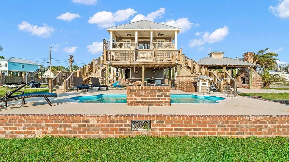 Shoreline Park House | Relaxing Waterfront Getaway with Pool, Boat Dock, and Ice House next door.