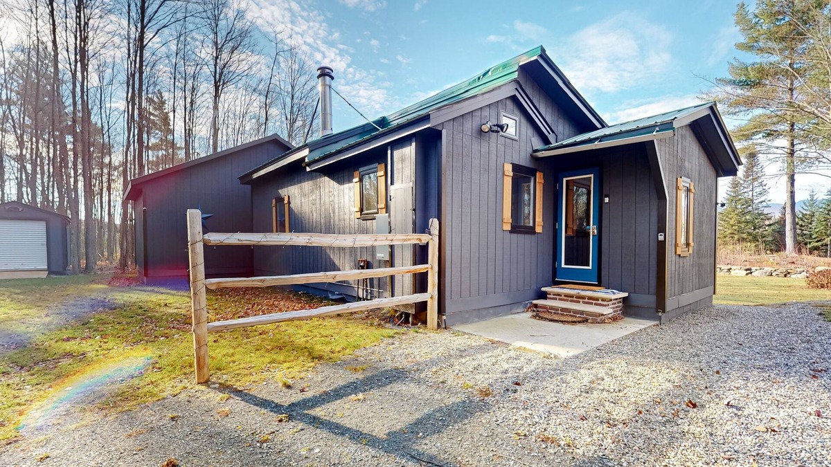 North Troy Cabin | Renovated historic cabin with mountain views, lake access, & electric fireplace