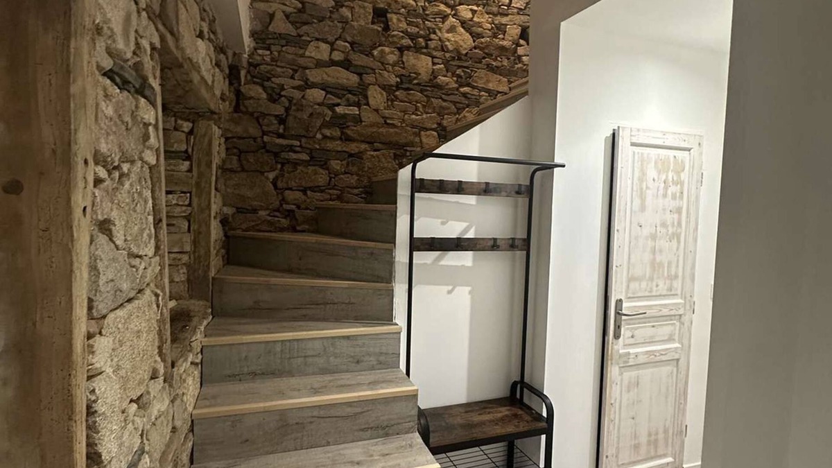 Nexon House | Renovated old house with large living room.