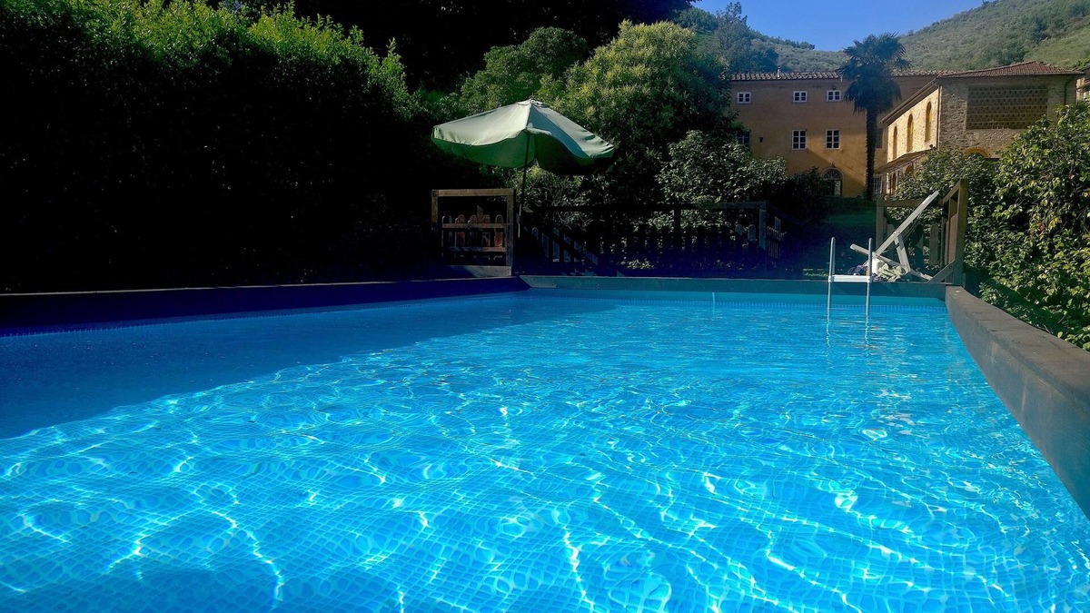 Sant'Andrea di Compito House | Restored barn with large pool and mountain stream