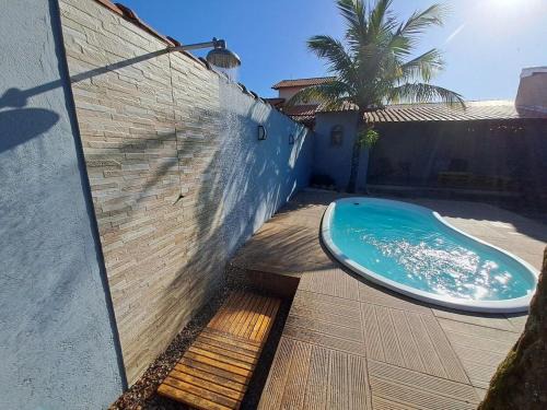 Itaipuacu Apartment | RiqueHouse: Piscina, churrasqueira a 500m da praia