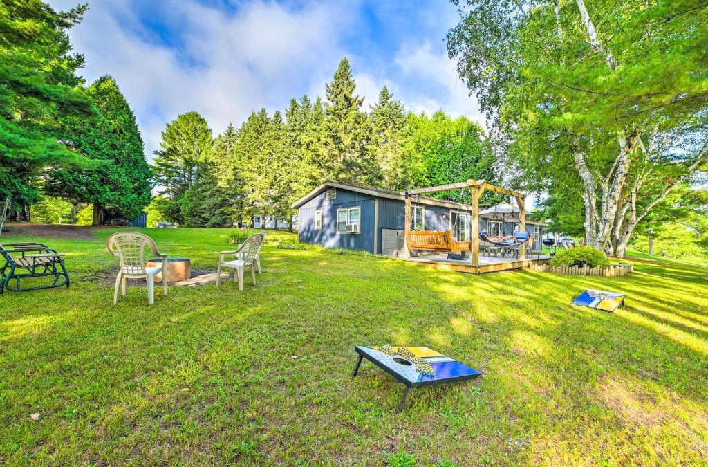 Cheboygan House | Riverfront Home with Dock about 6 Mi to Cheboygan!