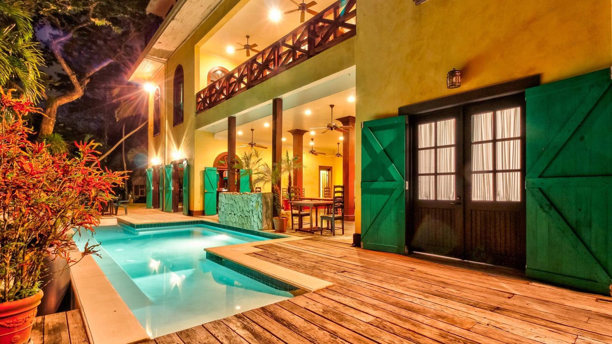 Bullet Tree Falls House | Riverfront Retreat with Balcony, WiFi, Partial AC, Shared Pool