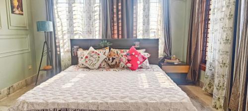 Sualkuchi Apartment | Riverside Palm Luxe 2BHK with AC in both bedrooms near Kamakhya & IHR