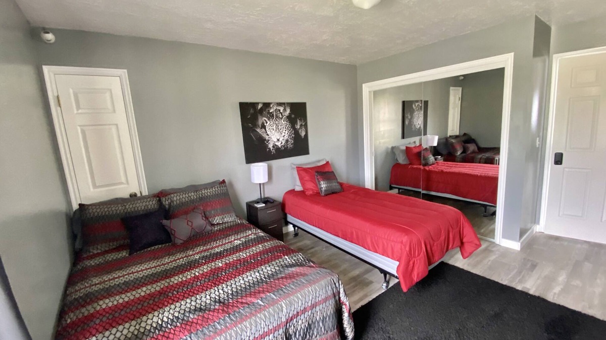 Emery County House | Rm #2. 1 double bed, 1 single bed smart TV, street/mountain view.