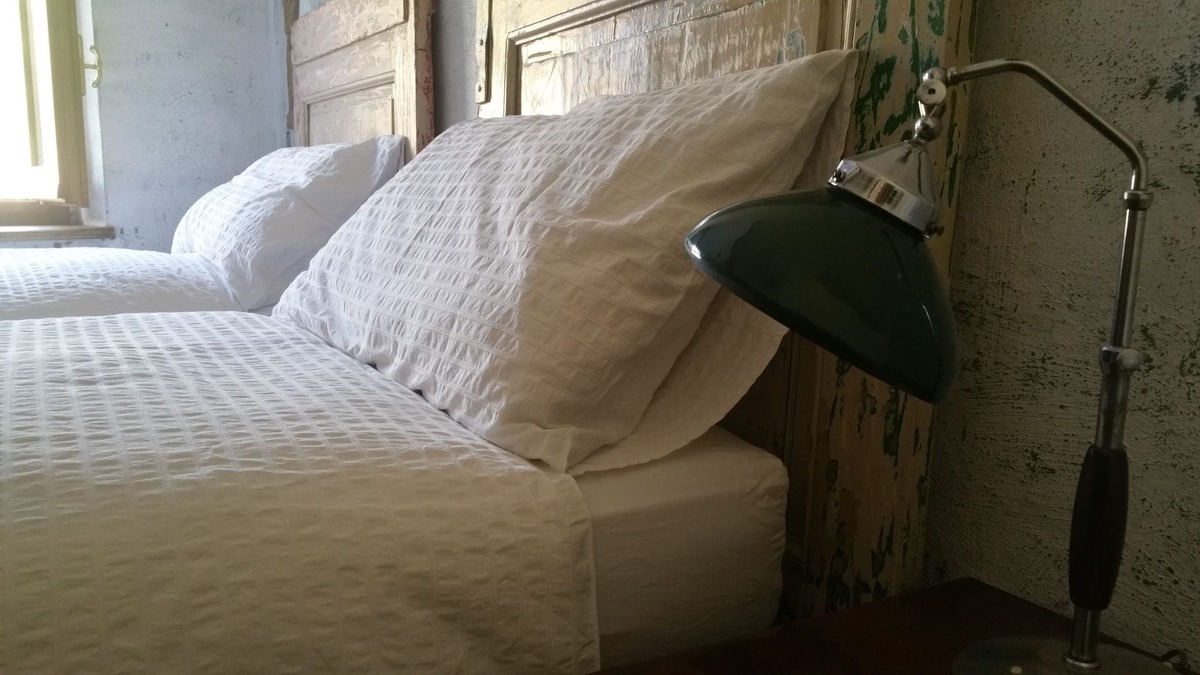 Passerano Marmorito House | Room with bathroom and hallway, 2 beds
