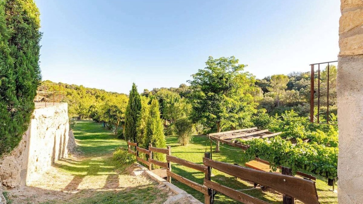 Hoz y Costean Cottage | Room with private bathroom and living room in a rural house