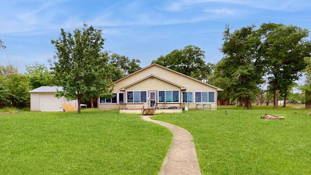 Cotton Gin House | Rural & unique waterfront home on Lake Limestone w/dock, waterslide & sunroom