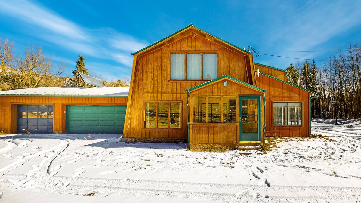 Cripple Creek House | Rustic home with mountain views, wood-burning stove, basketball court, & patio