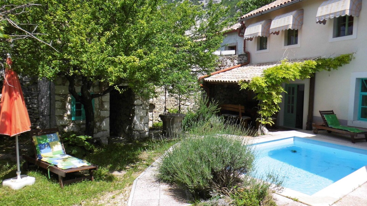 Drivenik House | Rustic stone house with pool