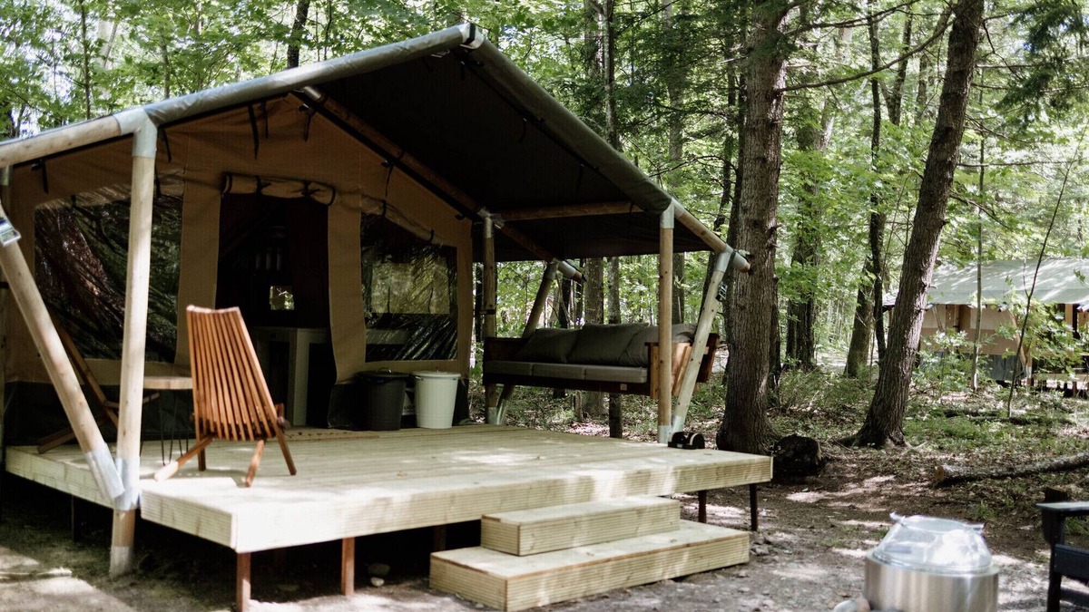 Woodstock RV Rental | Safari Tent Site 11 | 1 King Bed | Woods View