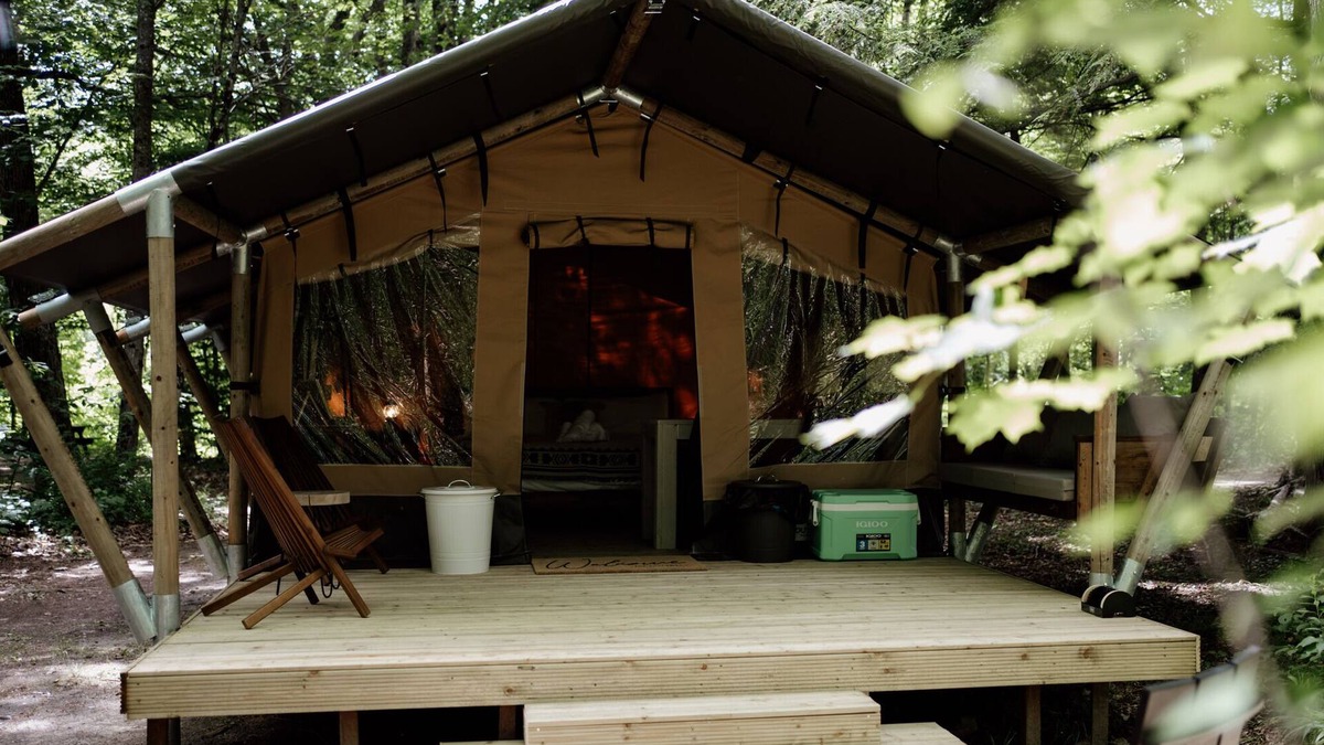 North Woodstock RV Rental | Safari Tent Site 12 | 1 King Bed | Woods View