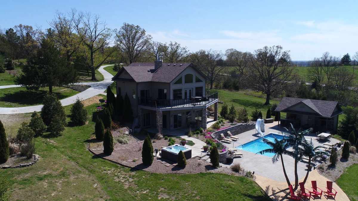 Belle House | Scenic Lakeside Chateau with Heated Pool, Hot Tub & Outdoor Kitchen-TV-Fireplace