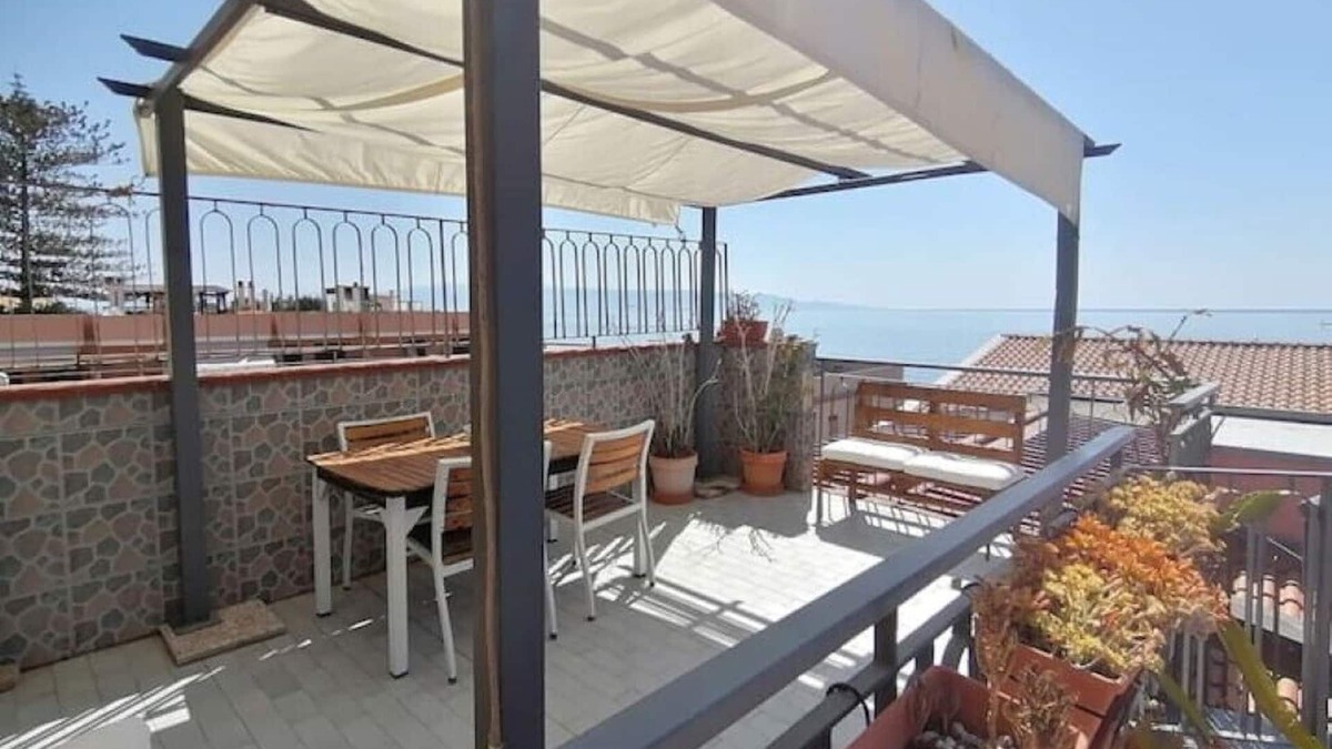 Roccalumera Apartment | Seafront, attic room with terrace.