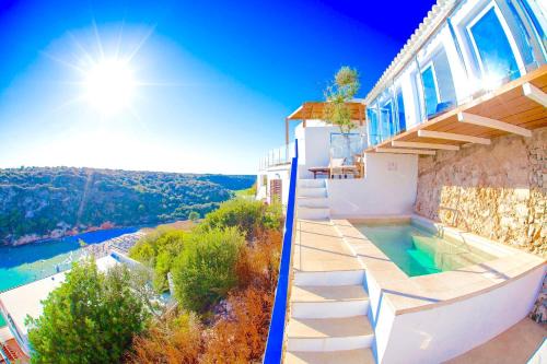 Cala en Porter Villa | Seafront Villa Bellavista with heated pool by DadoVillas