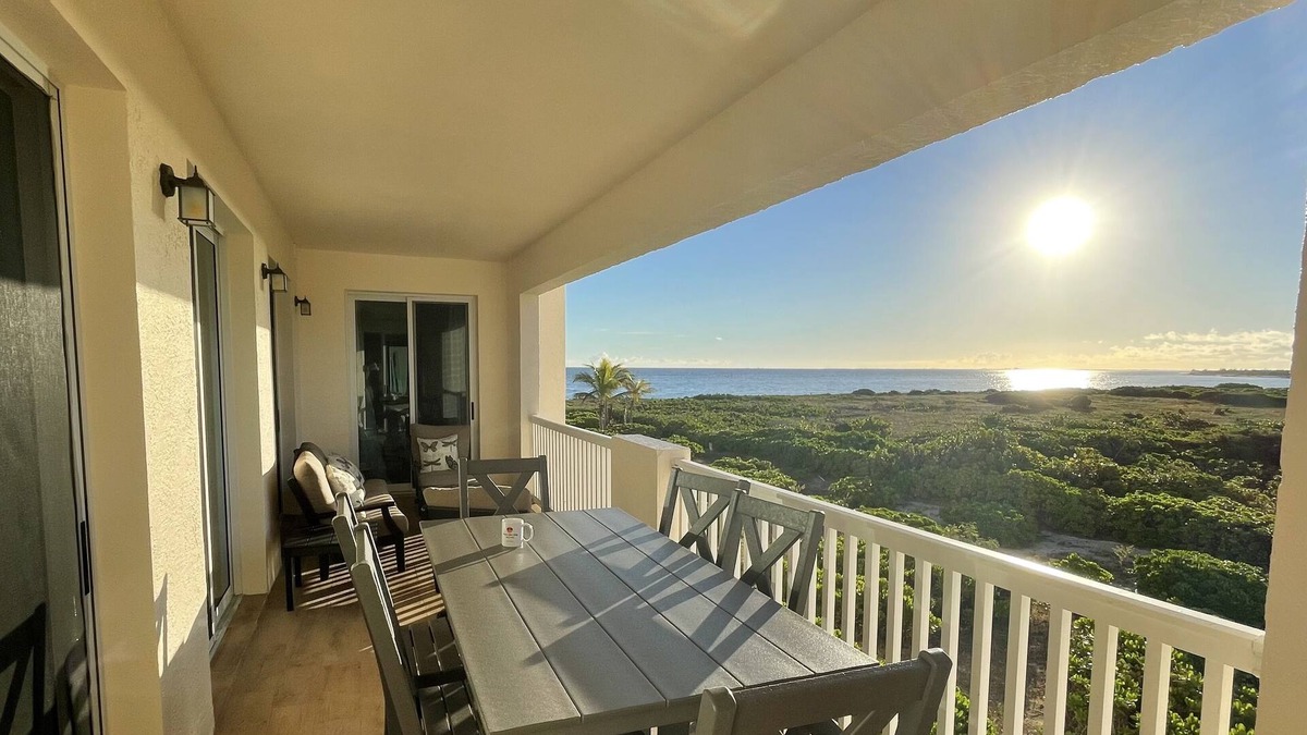 Wheeland Settlement Condo | Seas the Day TCI covered balcony, patio dining, gated entrance, on site security