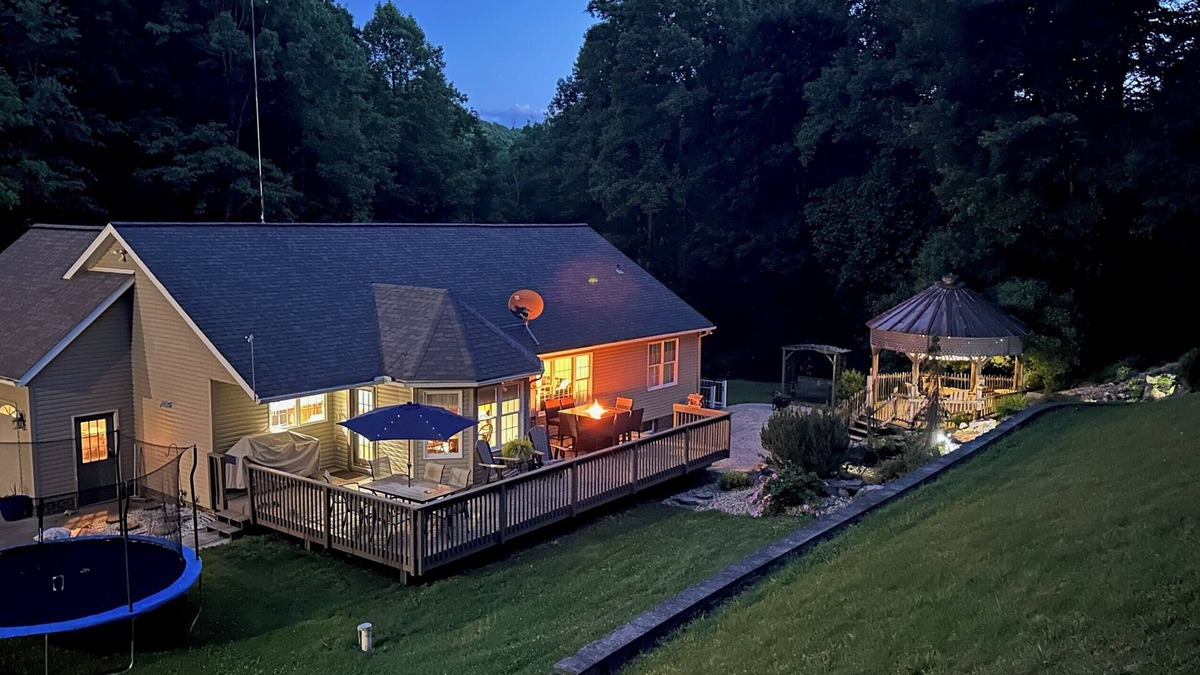 Killbuck House | Secluded peaceful family home! Large deck, patio, waterfalls, koi pond, hot tub!