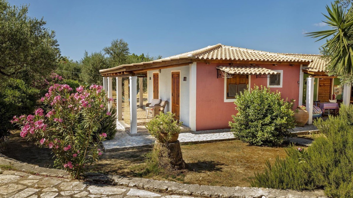 Vasilikos Cottage | Self catered cottage with large veranda and garden with hammock near the beach.