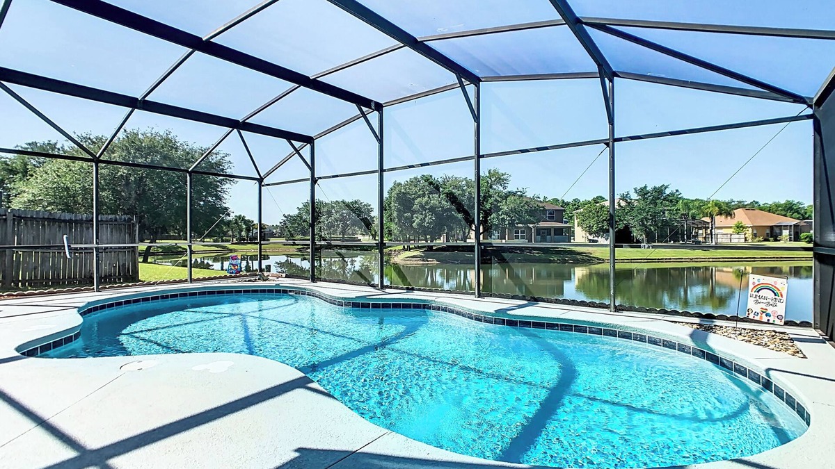 Crescent Lakes House | Smiling Disney Oasis heated pool home in Kissimmee with Game room.