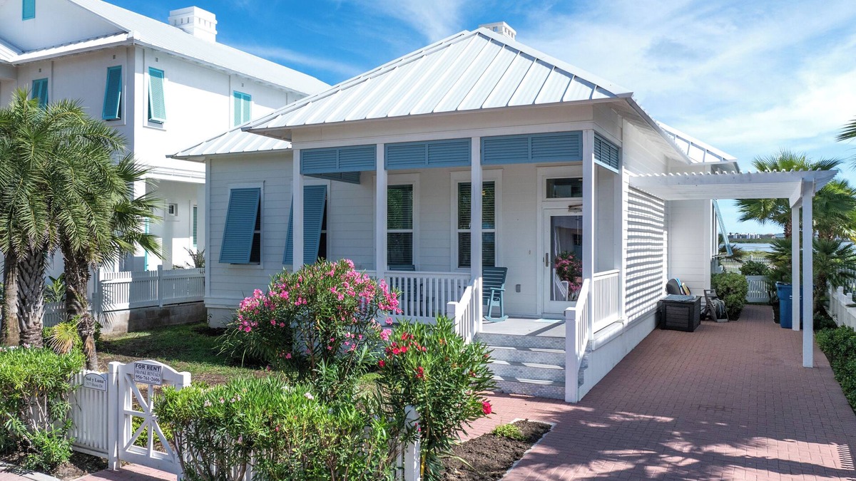 The Shores Cottage | Sol Y luna home at The Shores, sandy steps to the bay, short walk to the beach