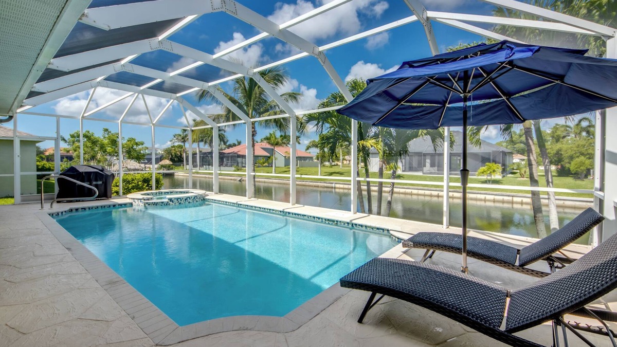 Pelican Villa | Spacious 4 BR/3 bath waterfront Villa with heated pool, spa, kayaks and bikes