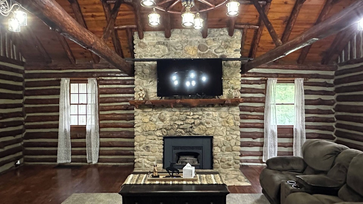Moberly Other | Spacious 5-bedroom log cabin home with 2 ponds and 50 acres just outside Moberly