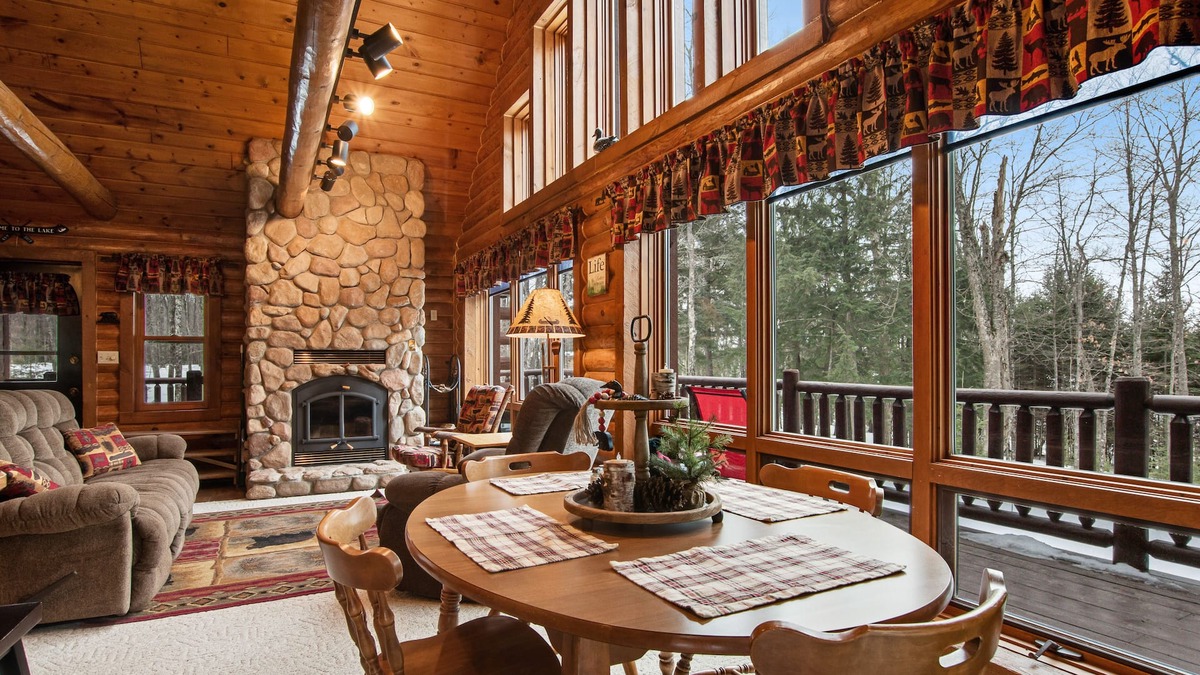 Presque Isle Cabin | Spacious and beautiful lakefront log home on 7 acres with private dock