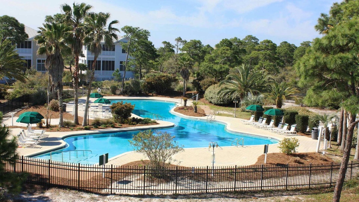 Plantation House | Spacious dog-friendly home with elevator, screened decks, on-site pool, & gym