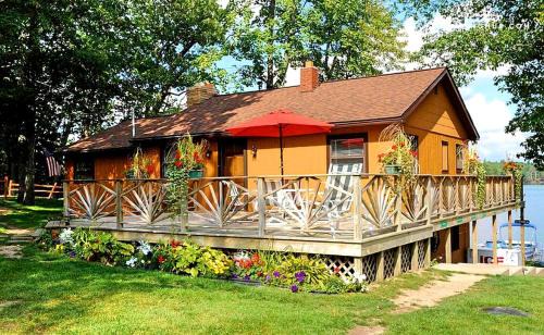West Branch House | Spacious Lake Cabin Rental with a Private Hot Tub in Ogemaw County, Michigan