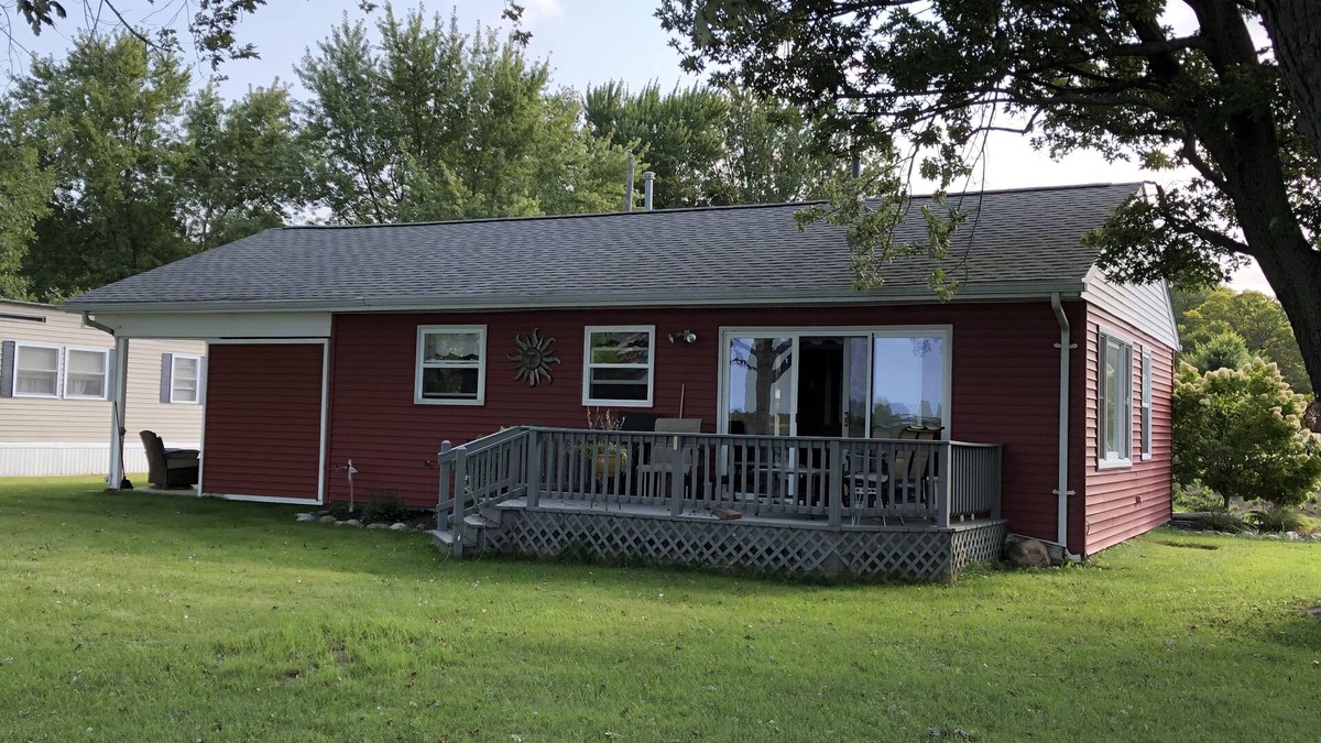Coldwater Cottage | Spectacular sunset views and north chain lake front red cottage rental