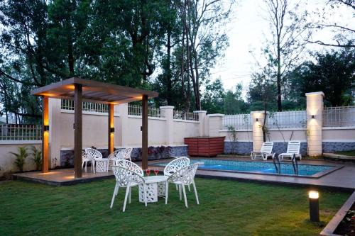 Mahabaleshwar Villa | StayVista's Skylight Serenity with Modern Interiors, Outdoor Pool, Poolside Gazebo, Manicured Lawn