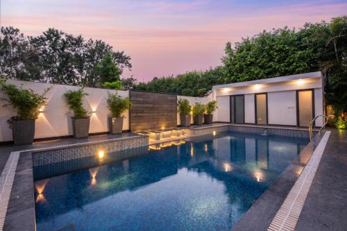 Ludhiana Villa | StayVista's The Secret Lagoon with Outdoor Pool, Verdant Lawn & Indoor-Outdoor Activities