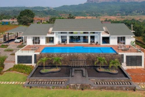 Lonavala Villa | StayVista's Villa 107 at Canary Farms - Pure Veg with Huge Lawn, Pool and Home Theatre