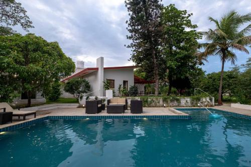 Nashik Villa | StayVista's Villaggio - Orchard Oasis with Pool, Expansive Lawn, Patio & Indoor Activities