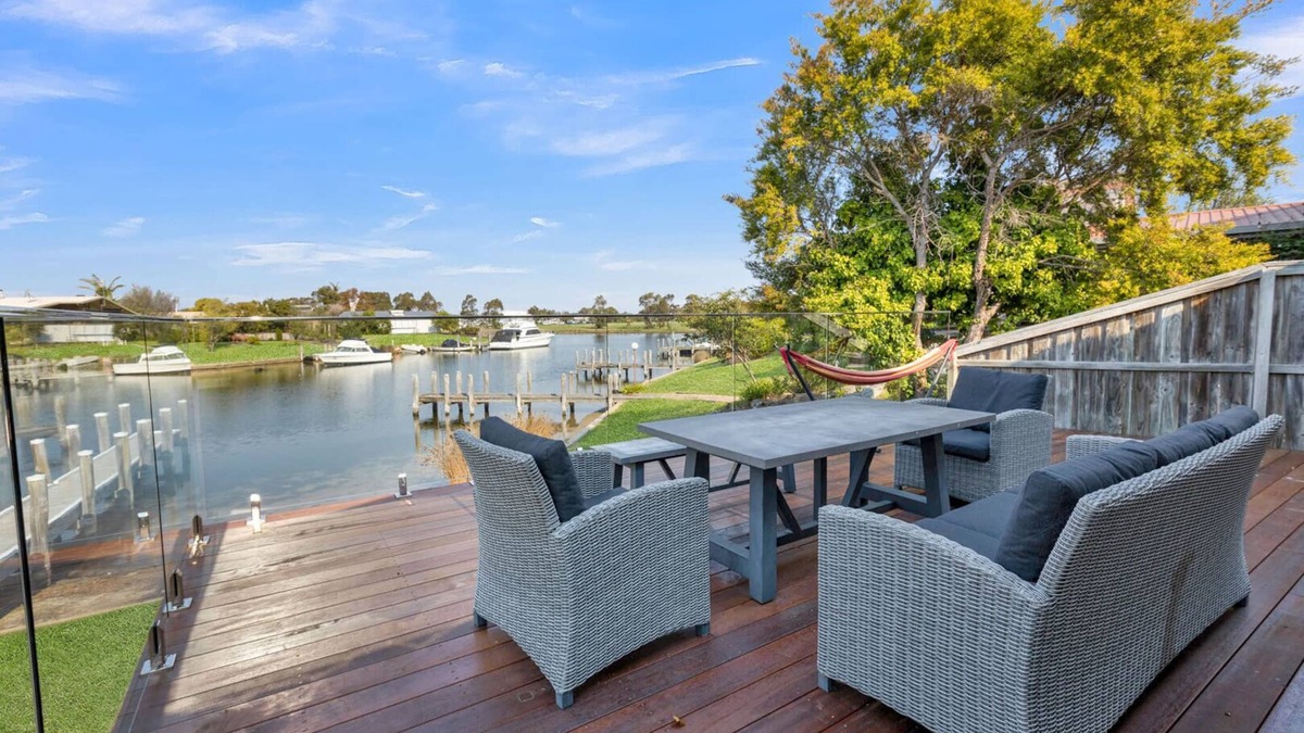 Paynesville House | Step onto the spacious deck and drink in the mesmerizing views of the water