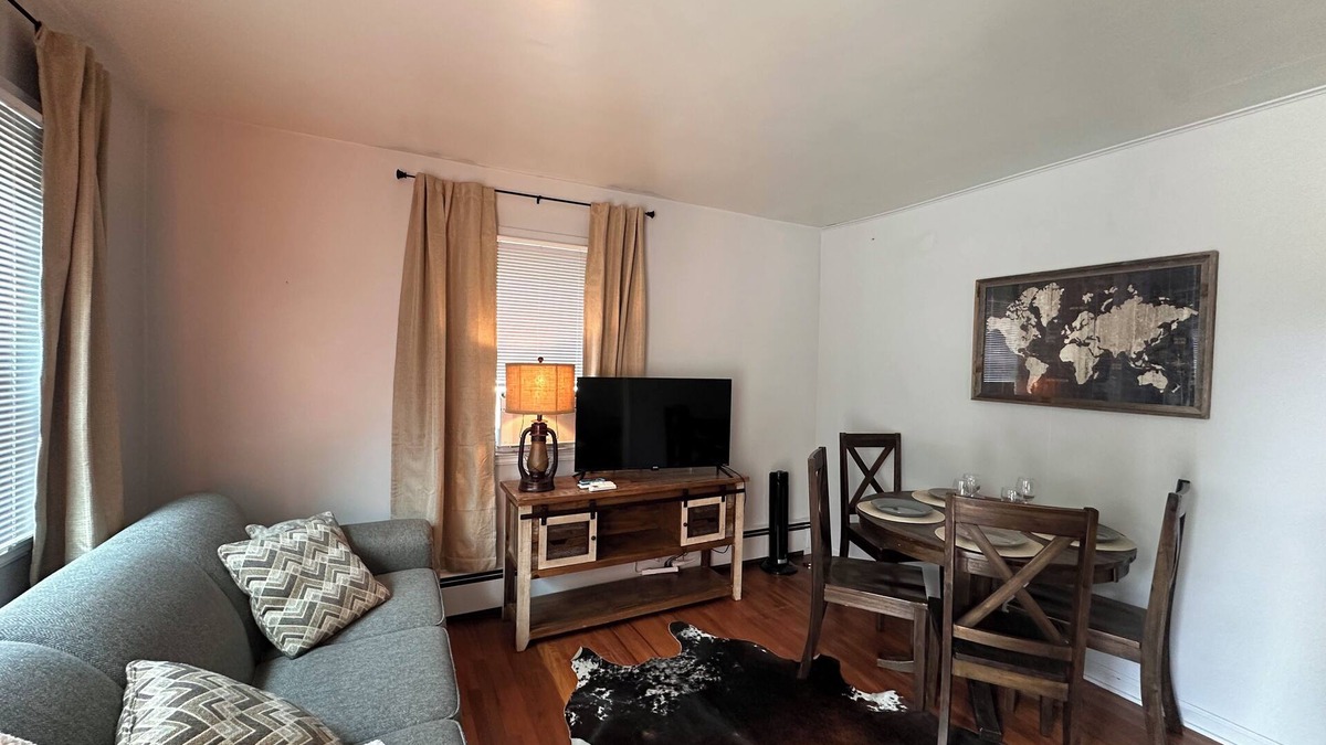 Sheridan House | "Steps from downtown and the park, this cozy mid-century hideaway offers comfort, charm, and a private outdoor escape."