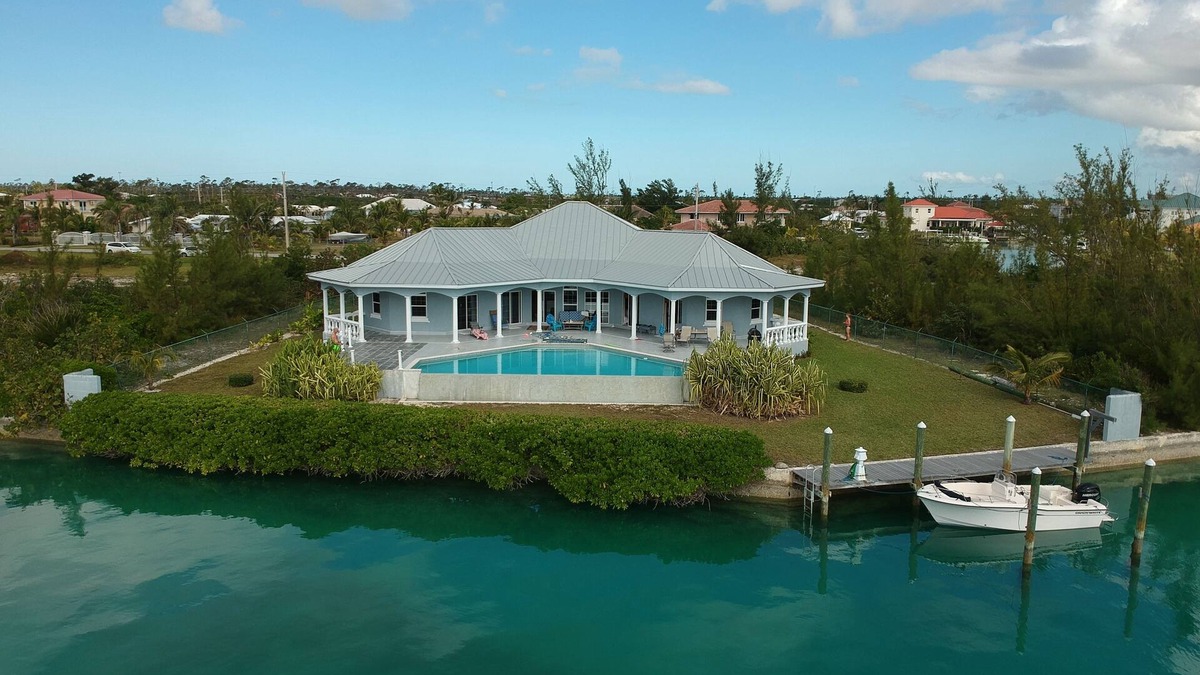 Bahamia West House | Stunning Freeport Grand Bahama Villa on Canal, with Infinity Pool & 40 ft dock