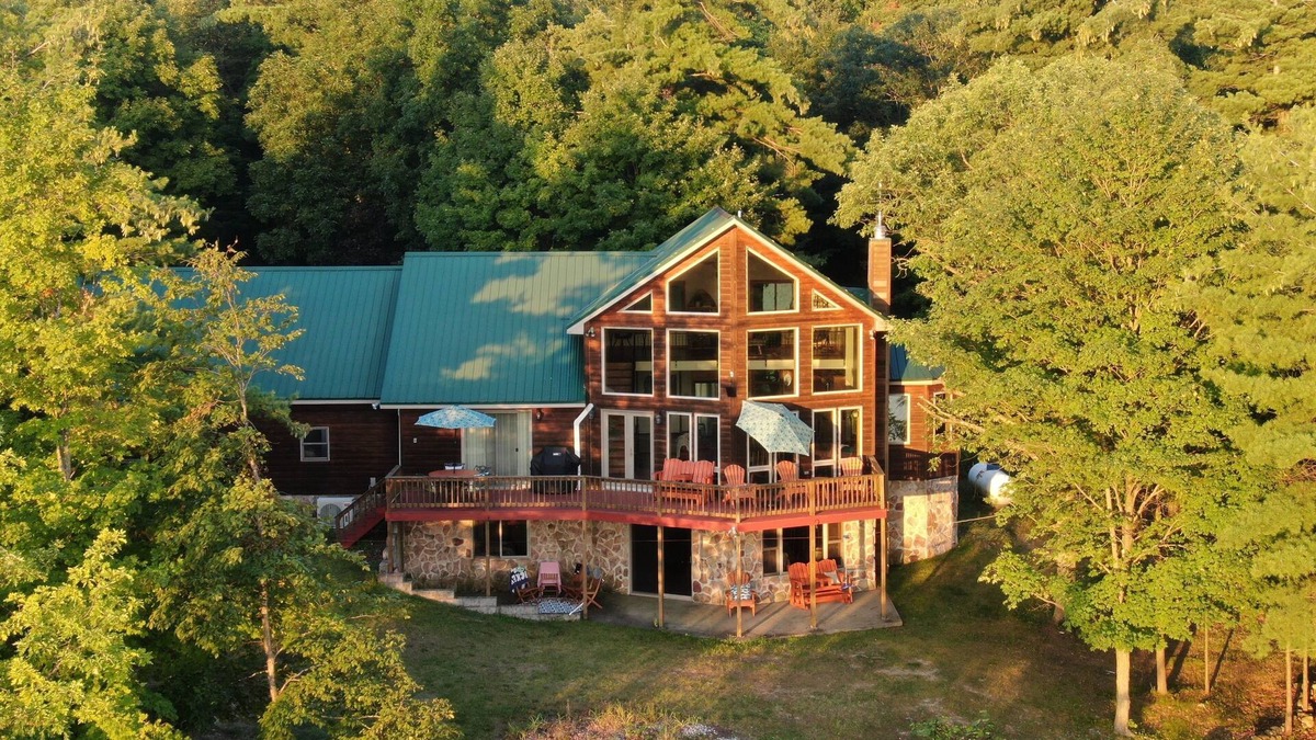Town of Macomb Cabin | Stunning lake cabin 8 acres of woods, private boat dock, AC, WiFi & dog-friendly