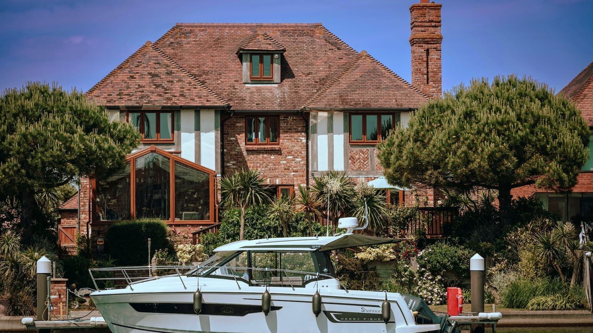 Eastbourne House | Stunning waterside six-bed house with water views, gardens and private jetty