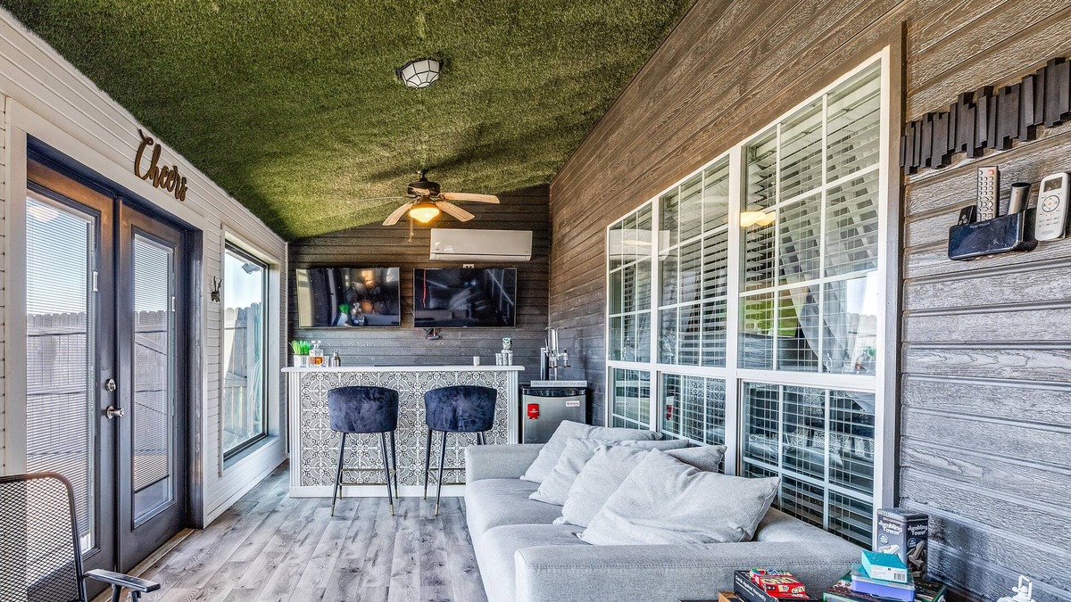San Angelo House | Stylish corner home with cozy interiors, a private bar, and inviting charm