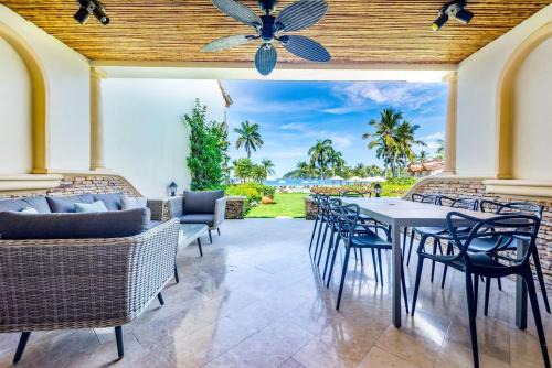 Playa Flamingo House | Stylish Split-Level Condo with a Shaded Terrace, Direct Beach Access, and Resort-Style Community Amenities