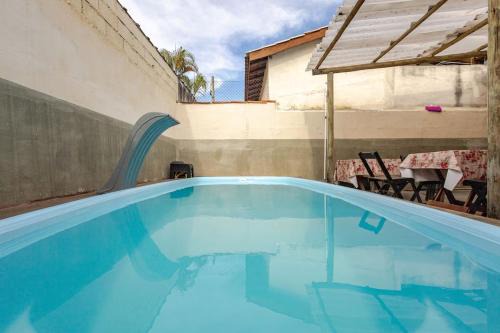 Centro Comercial House | Suite Ilhabela passos da praia