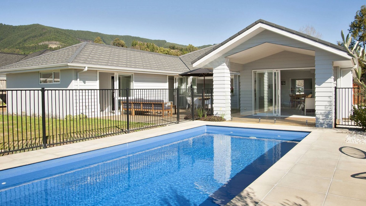 Richmond House | Sunny & spacious modern home with heated swimming pool.