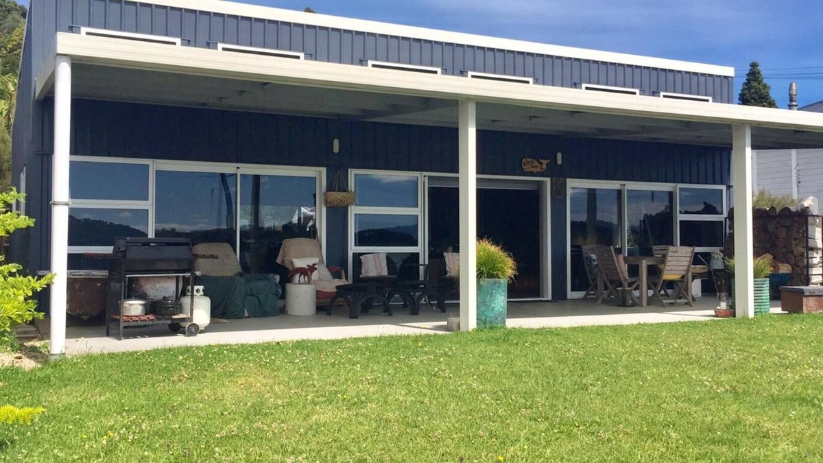 Taharoa House | Te Waitere Village spectacular water views of harbour and surrounding hillsides.