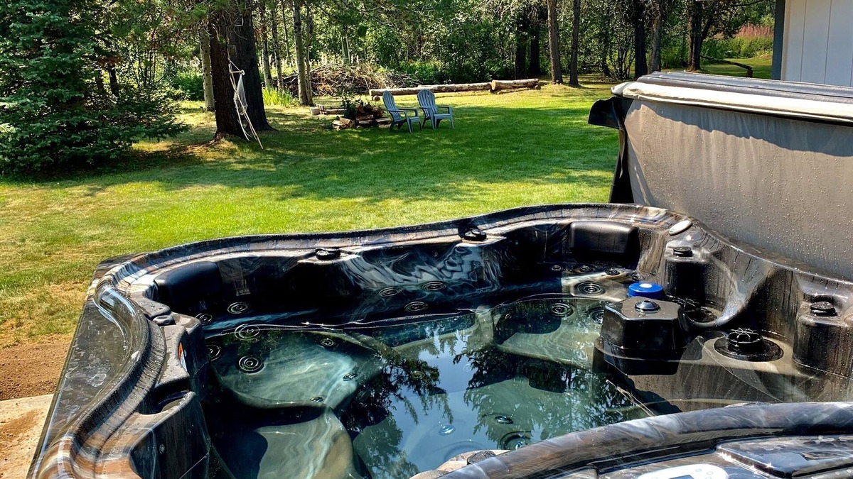 Wagon Wheel House | The Barndominium 167 with a Hot Tub on a 1/2 acre