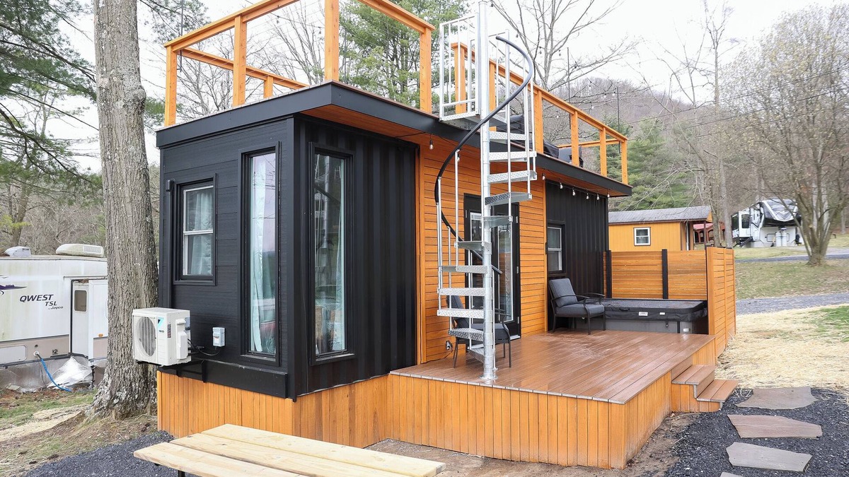 Mingoville Cabin | The Bellefonte Campground presents: The Luxury Hideaway Container Home, hot tub, Rooftop veranda, and more.